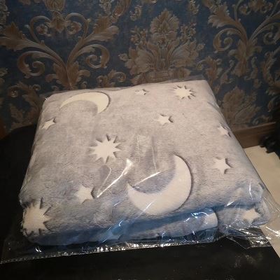package of night glow flannel fleece blanket